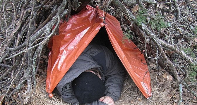 basic survival course - emergency blanket as shelter