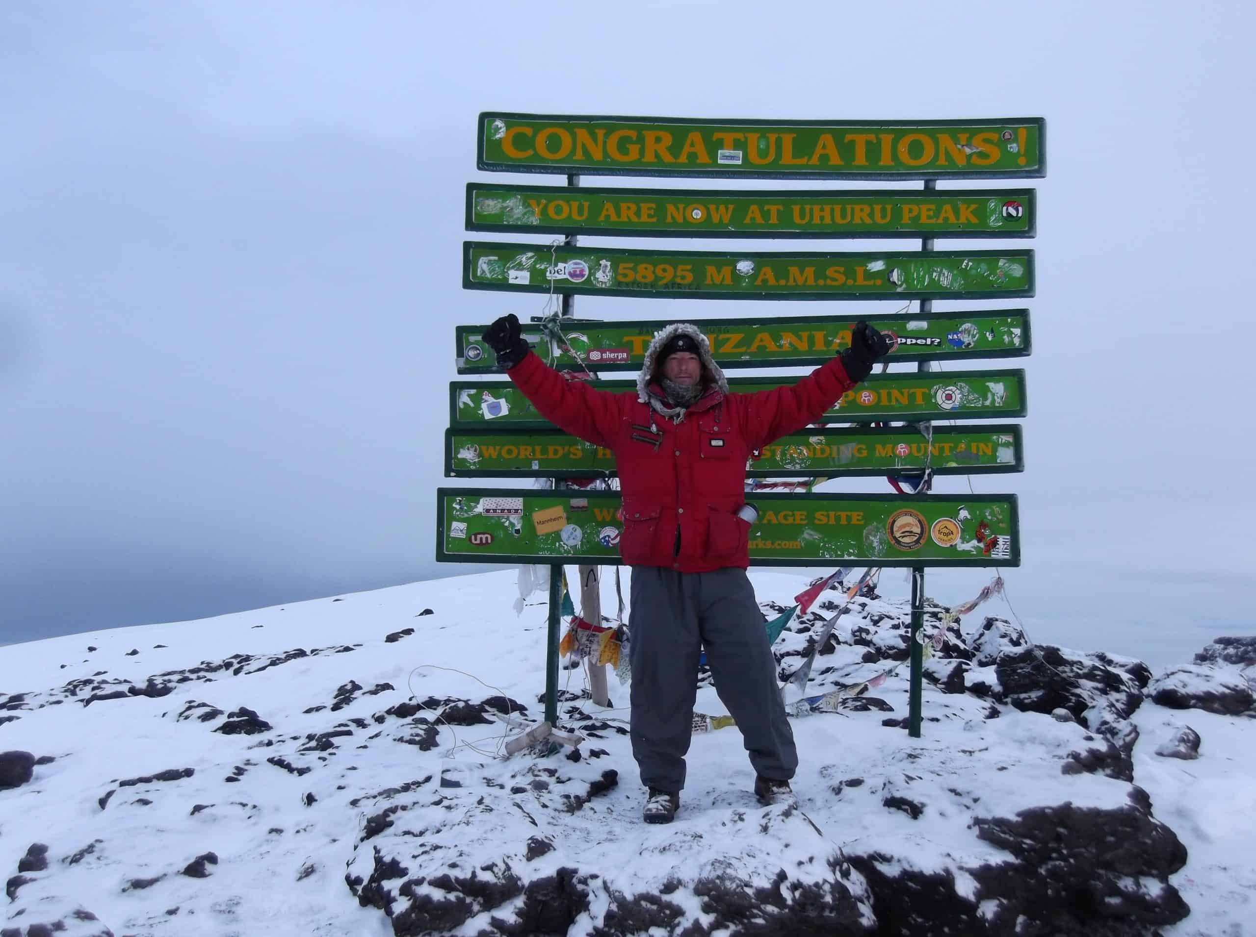 wilderness survival training course - Alex Mileham on the summit of mt kilimanjaro Africa