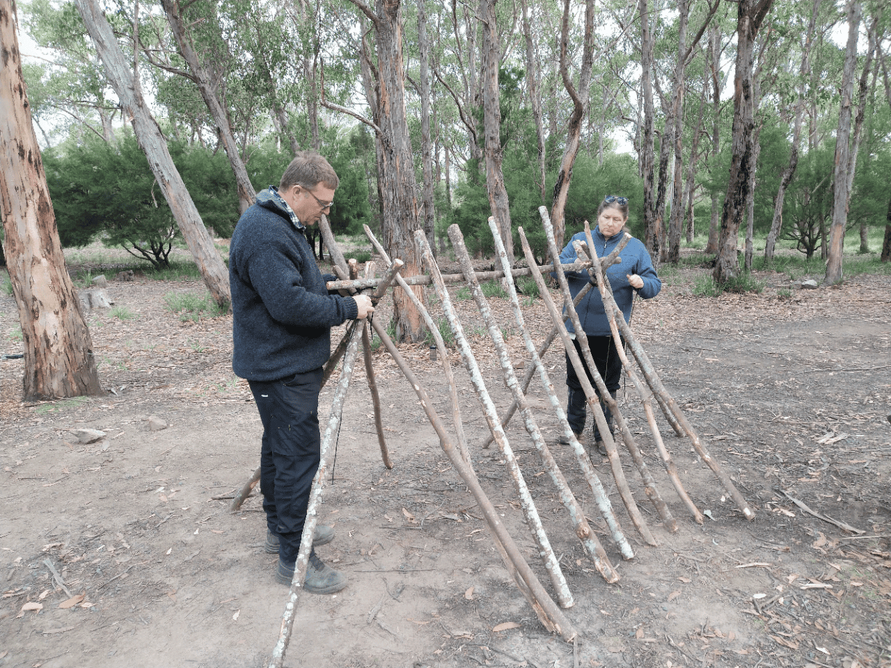 survival courses australia - group building a natural lean-to shelter