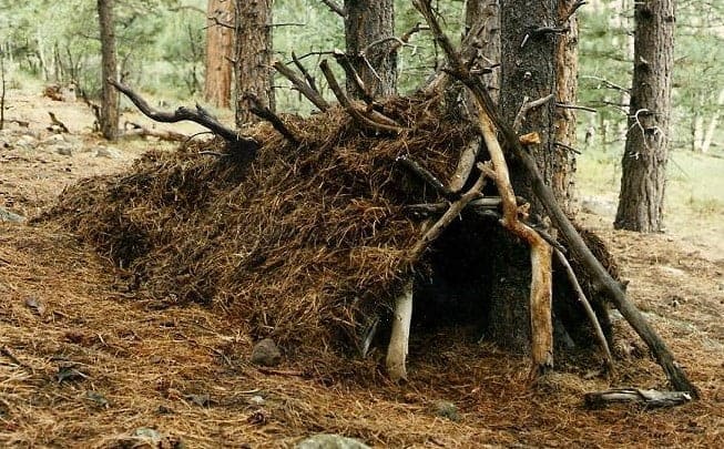 SERE survival shelter - natural debris shelter